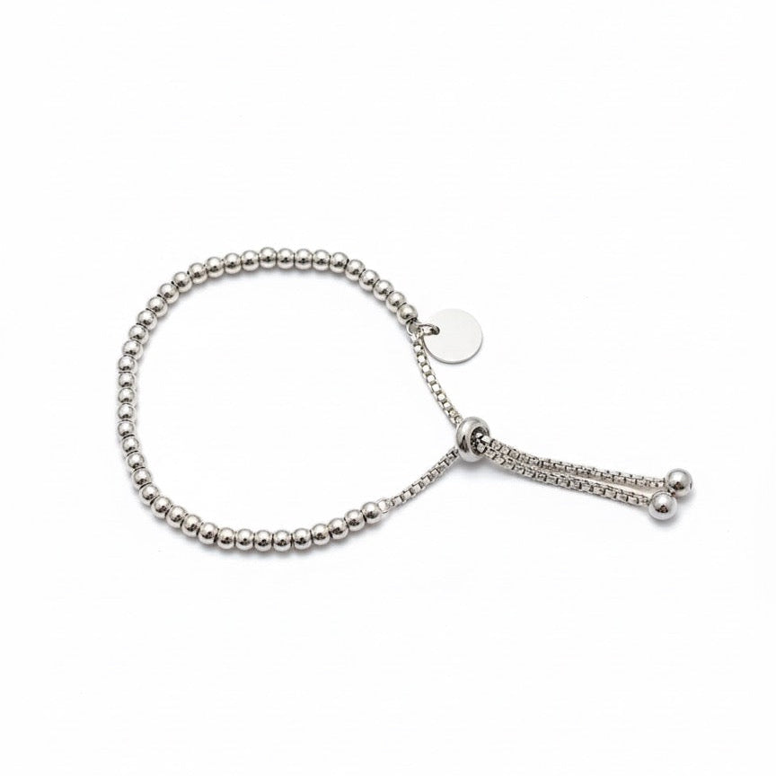 Silver beaded bracelet on a white background