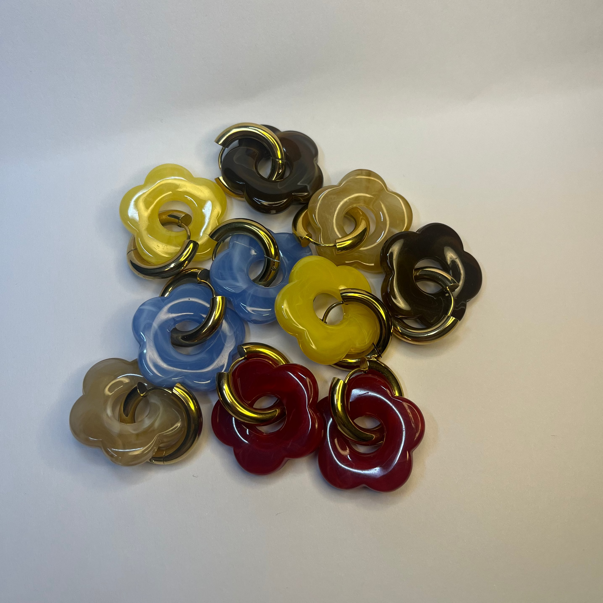Colorful flower-shaped buttons on a white background