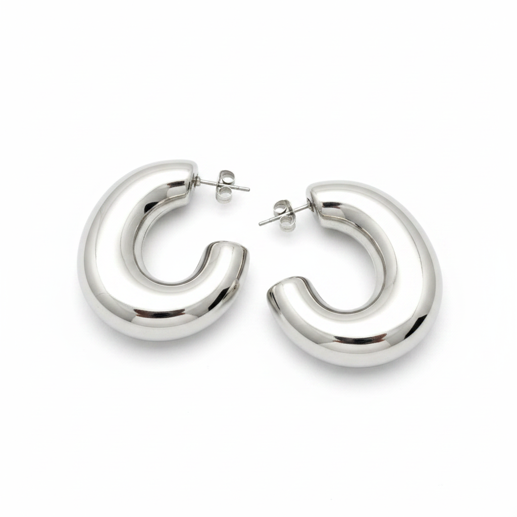 Pair of silver hoop earrings on a light gray background