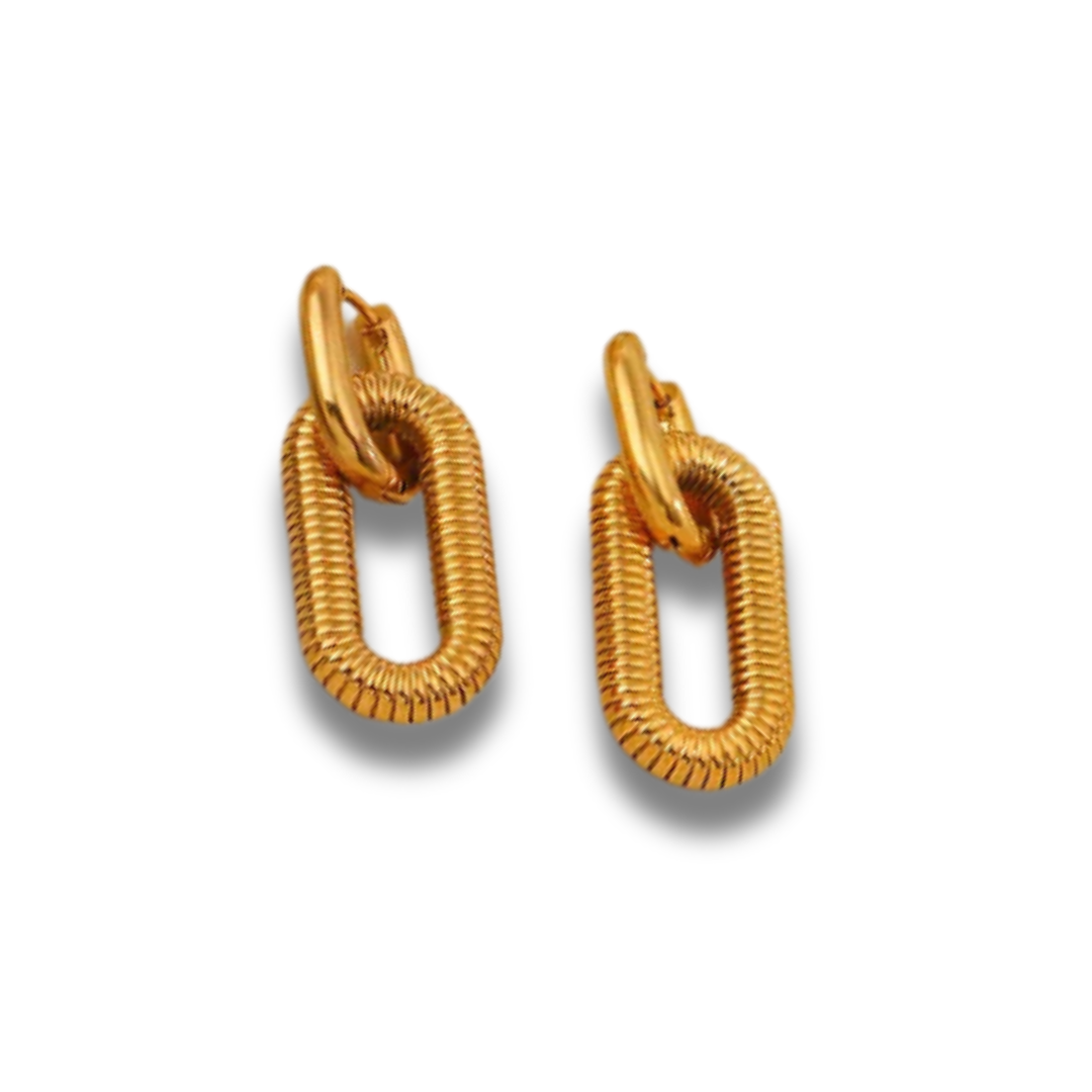 Gold hoop earrings on a white background