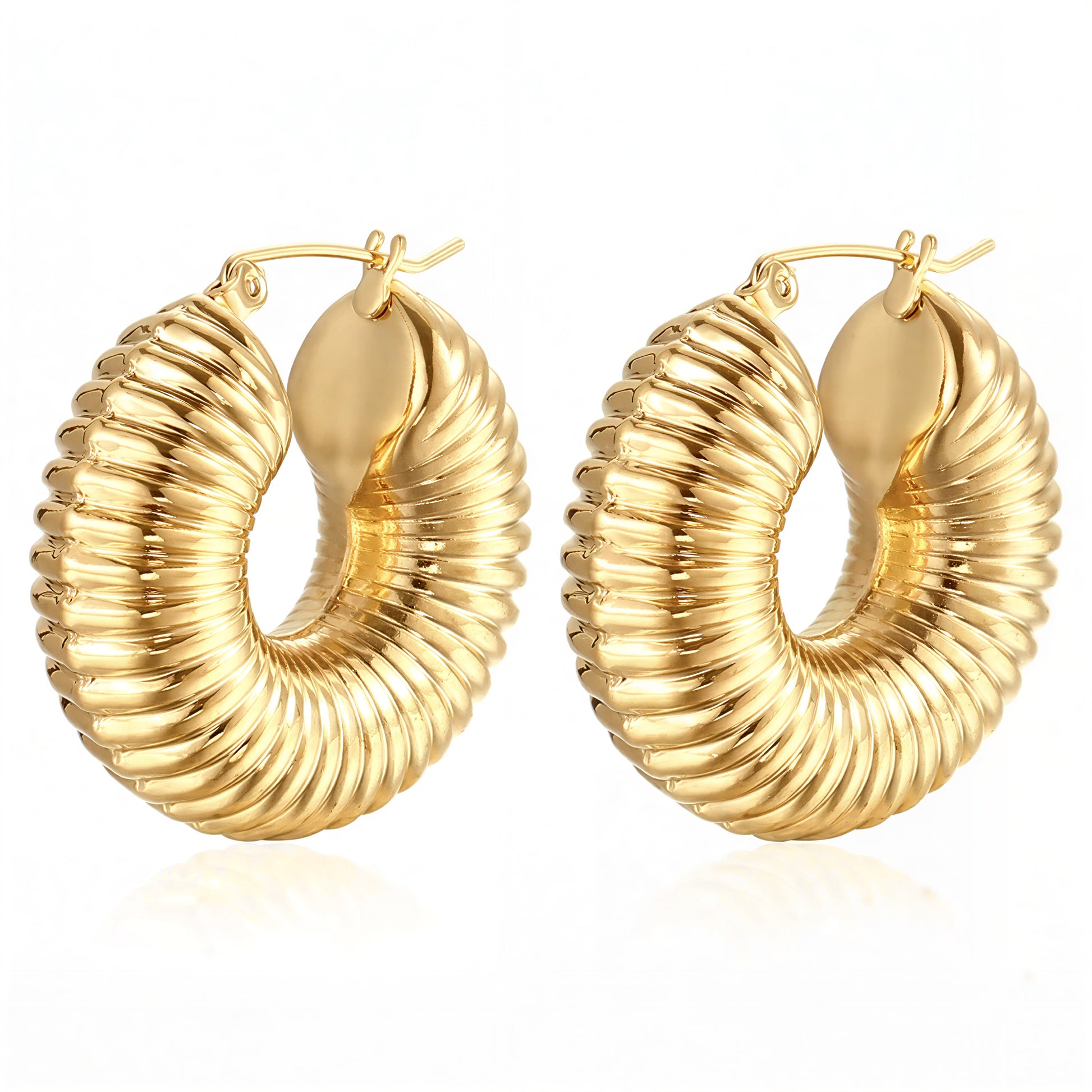 Pair of gold hoop earrings on a white background