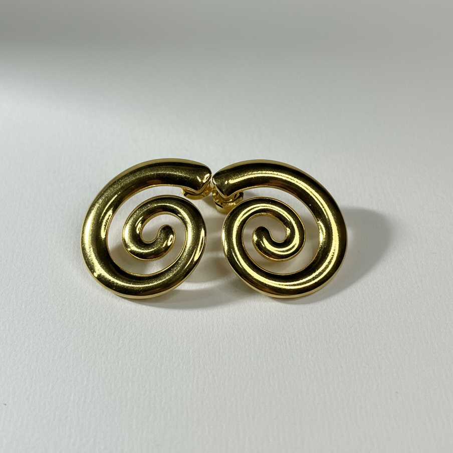Gold spiral earrings on a white background